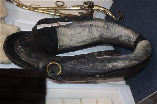 A heavy horse leather collar and brass hames